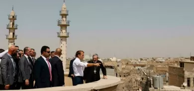 Macron visits the former IS group's stronghold in Iraq city of Mosul