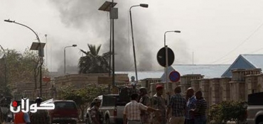 Bombings kill at least 25 people near government offices in Baghdad