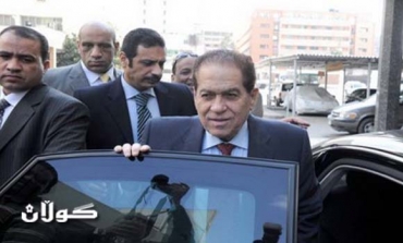 Egypt’s interim PM says military to remain until June