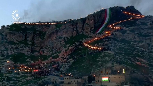 Iraqi Kurds celebrate Nowruz with torchlit mountain procession